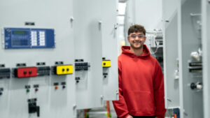 Photo of UW–Oshkosh student A.J. Korth checks out a switchgear created by Switchgear Power Systems, during a tour of the plant in Winneconne.