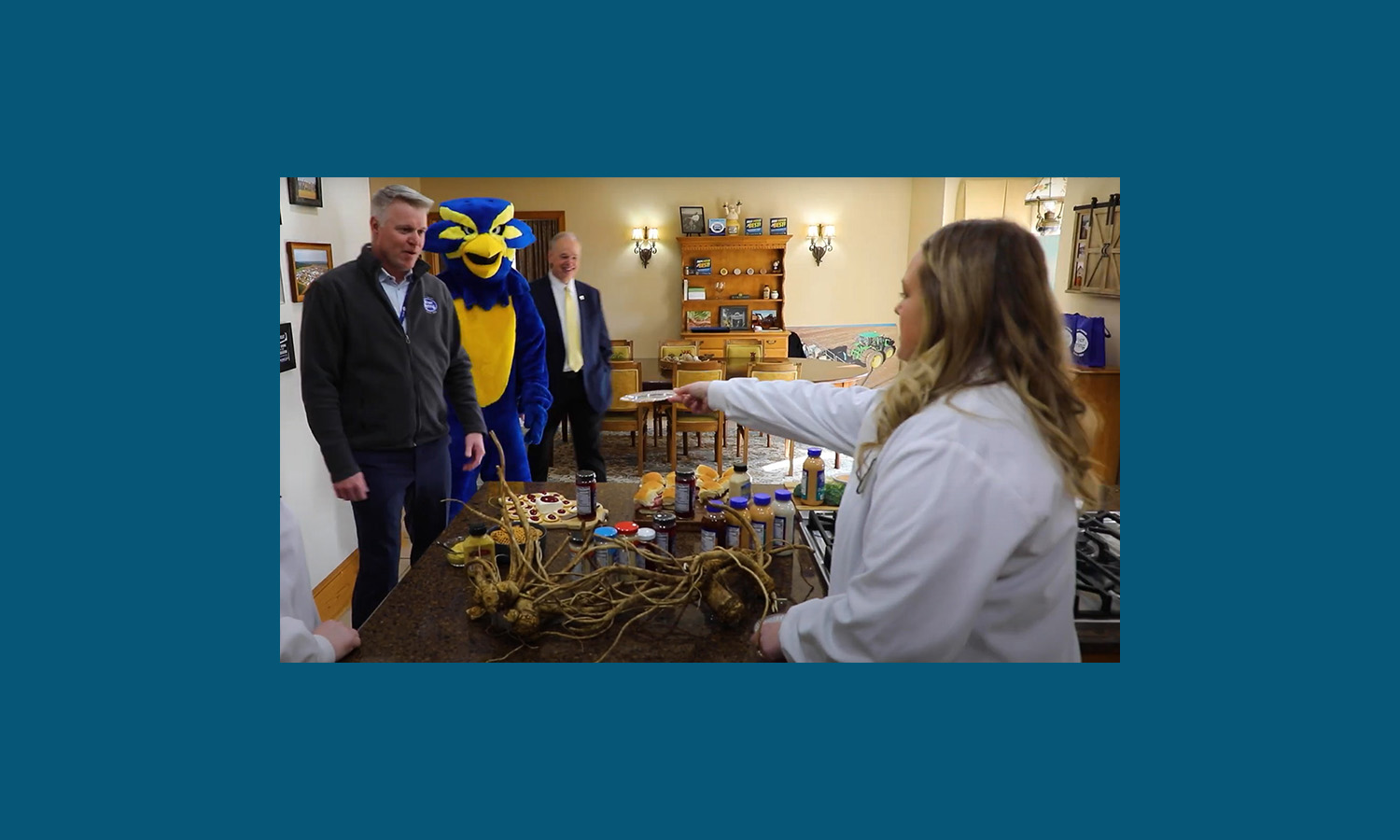 Blu & Chancellor Schmidt highlight UW-Eau Claire’s partnership with Silver Spring Foods in “Mascots on Main” campaign