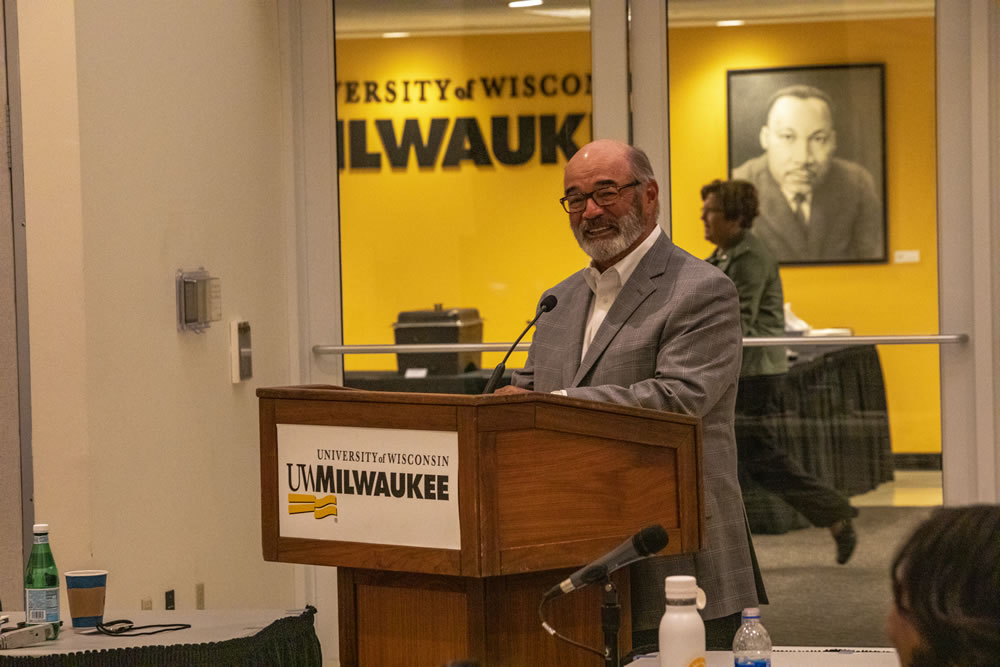 Photo of Regent Emeritus Michael J. Falbo speaking about Regent Eve Hall's service on the board