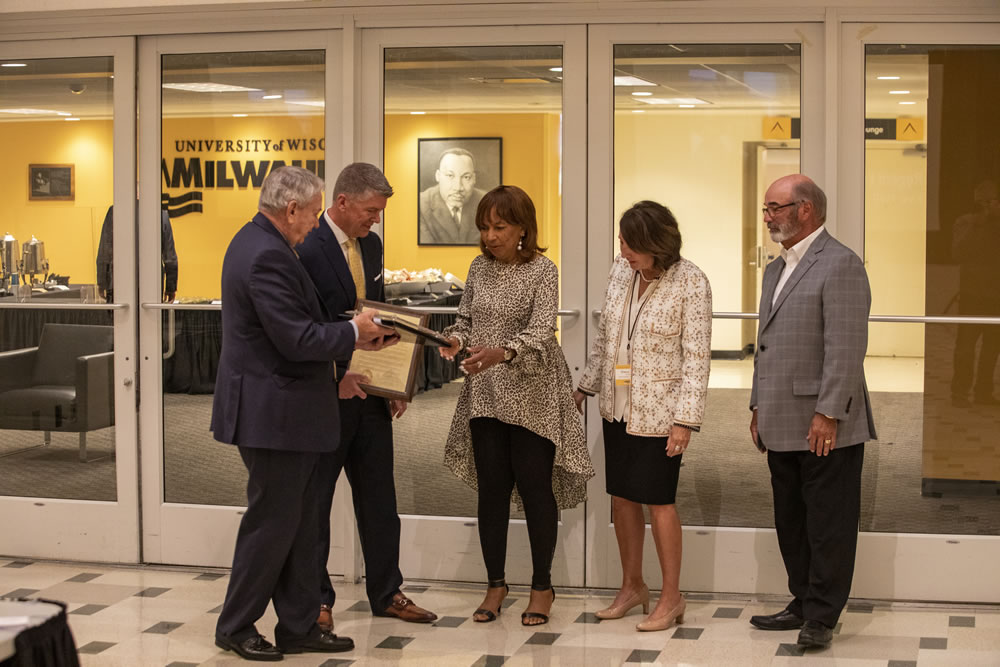 Photo of Regent Eve Hall being presented with her resolution of appreciation for her service as a regent