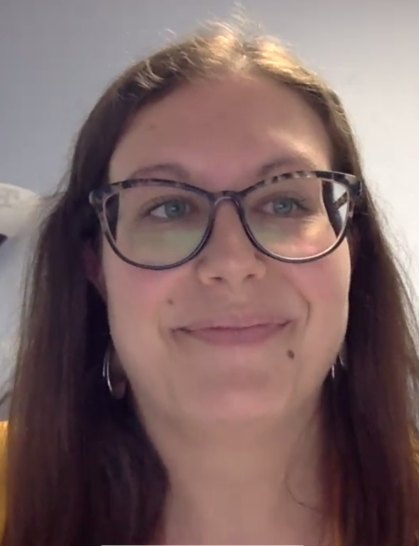 Photo of Project Success Director Jayme Reichenberger, UW Oshkosh, accepting the Board of Regents 2021 Academic Staff Excellence Award on the program's behalf