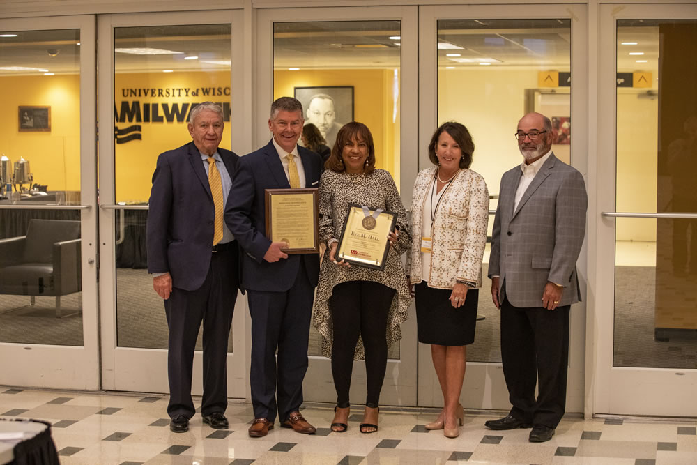 Photo of Regent Eve Hall (center) receiving her resolution of appreciation; (from left) Thompson, Petersen, Hall, Klein, and Falbo